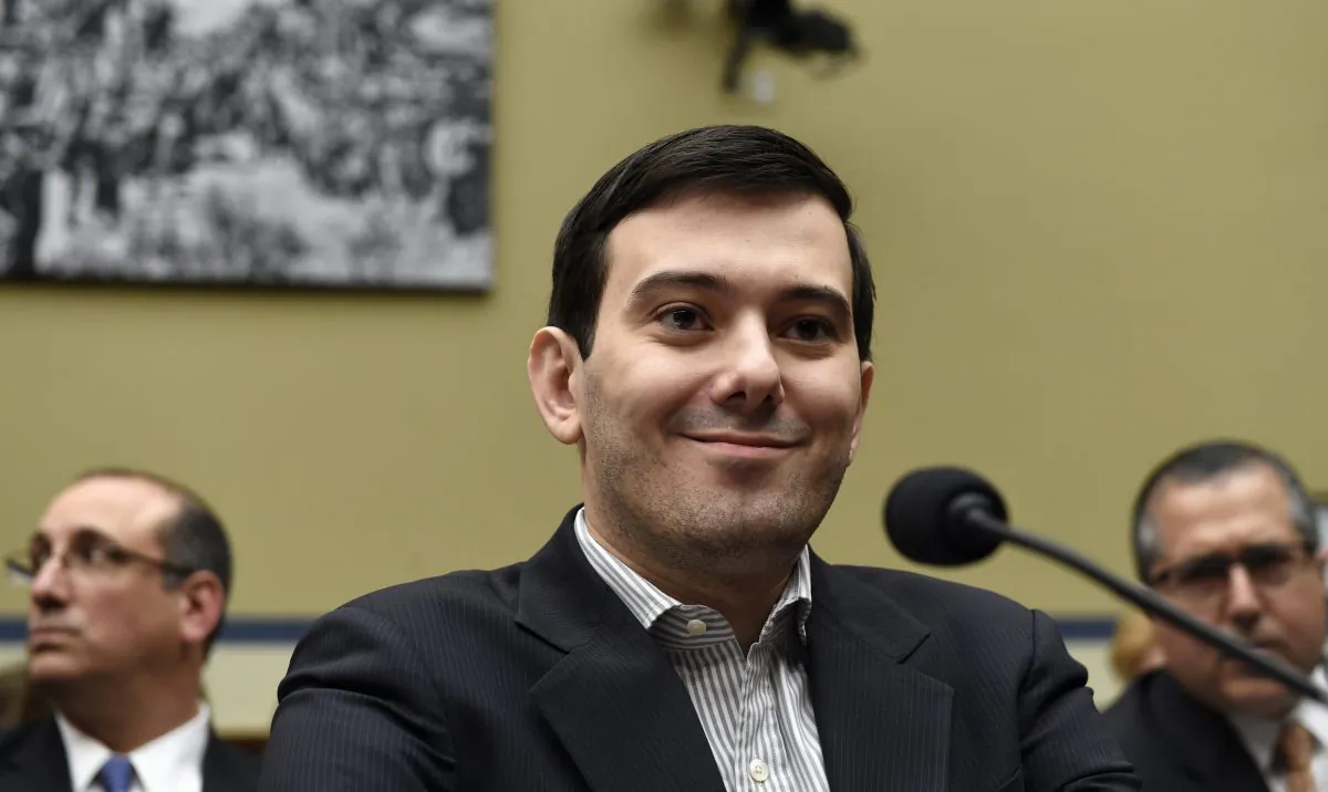 Pharmaceutical chief Martin Shkreli listens on Capitol Hill in Washington, D.C., on Feb. 4, 2016, during the House Committee on Oversight and Reform Committee hearing on his former company's decision to raise the price of a lifesaving medicine. Shkreli refused to testify before U.S. lawmakers who excoriated him over severe hikes for a drug sold by a company that he acquired. (AP Photo/Susan Walsh)