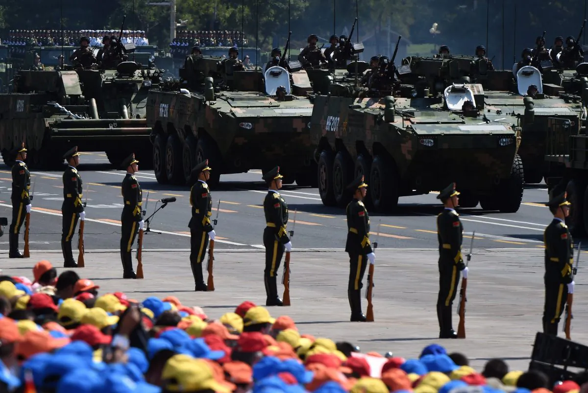 Members of the Chinese regime's People's Liberation Army participate in a large-scale military parade in Beijing on Sept. 3. The U.S. secretary of defense, Ash Carter, warned that China and Russia are prepping for a rapid form of war. (Greg Baker/AFP/Getty Images)