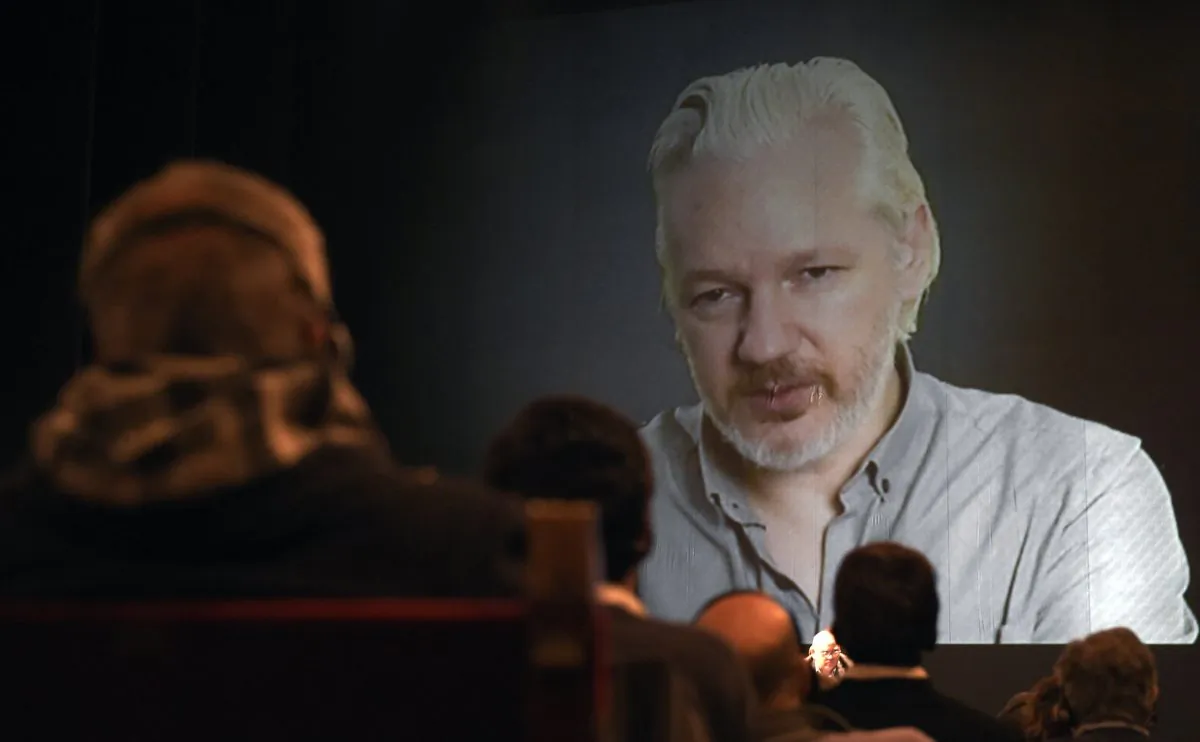 Wikileaks founder Julian Assange (on the screen) takes part in a teleconference during the 2nd International Congress on Universal Jurisdiction in Buenos Aires on Sept. 9, 2015. ( Juan Mabromata/AFP/Getty Images)