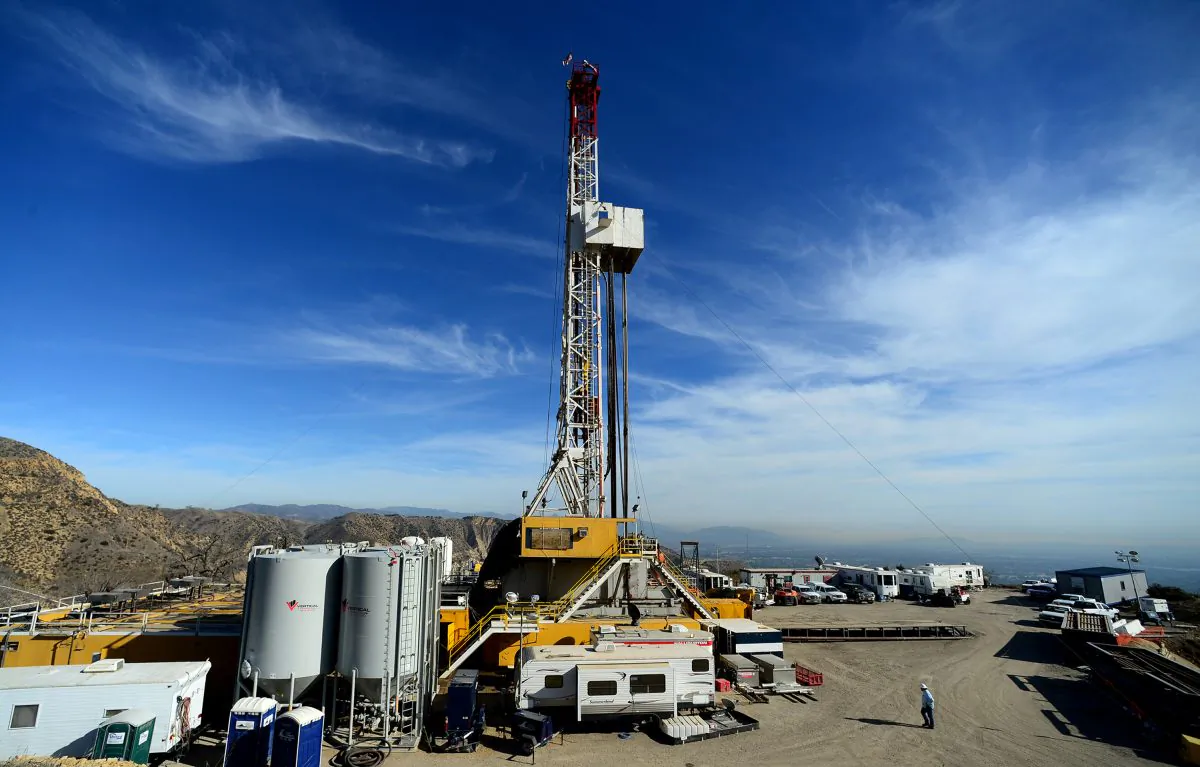 In this Dec. 9, 2015, pool file photo, crews work on a relief well at the Aliso Canyon facility above the Porter Ranch area of Los Angeles. (Dean Musgrove/Los Angeles Daily News via AP)