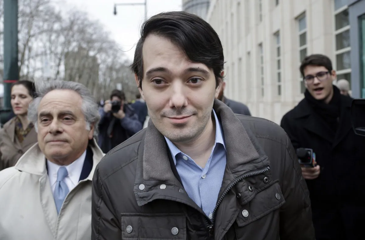 Former Turing Pharmaceuticals CEO Martin Shkreli (C) leaves court with his lawyer Benjamin Brafman (L) in New York on Feb. 3, 2016. Shkreli, who has become the poster child of pharmaceutical-industry greed after hiking the price of an anti-infection drug by more than 5,000 percent, is scheduled to appear at a congressional hearing on Thursday. (AP Photo/Seth Wenig)
