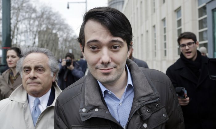 Former Turing Pharmaceuticals CEO Martin Shkreli (C) leaves court with his lawyer Benjamin Brafman (L) in New York on Feb. 3, 2016. Shkreli, who has become the poster child of pharmaceutical-industry greed after hiking the price of an anti-infection drug by more than 5,000 percent, is scheduled to appear at a congressional hearing on Thursday. (AP Photo/Seth Wenig)