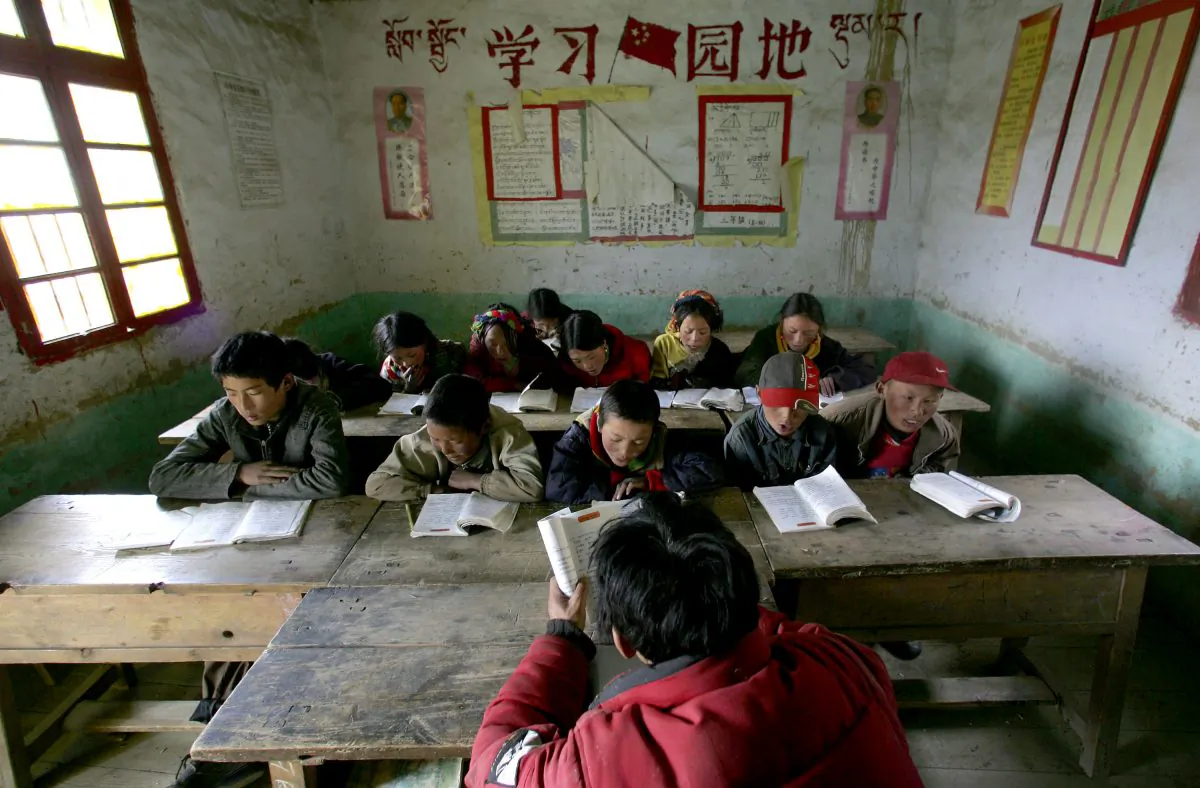 Tibetan students attend a class at Sichuan Province on April 15, 2005. Chinese Internet users reacted with outrage about how some poor students were treated. (China Photos/Getty Images)