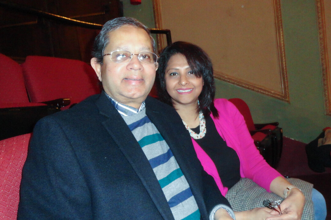 Former chief economist Khan Zahid and his wife, kindergarten teacher Samia, enjoying an afternoon at Shen Yun Performing Arts at the Rochester Auditorium Theatre, on the eve of the Chinese New Year, Feb. 7, 2016. (Madalina Hubert/Epoch Times Staff)