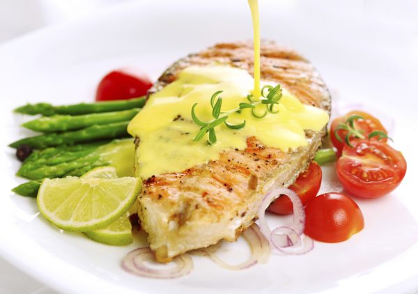 Grilled salmon with lime, asparagus and saffron sauce with rosemary (ElenaGaak/iStock)