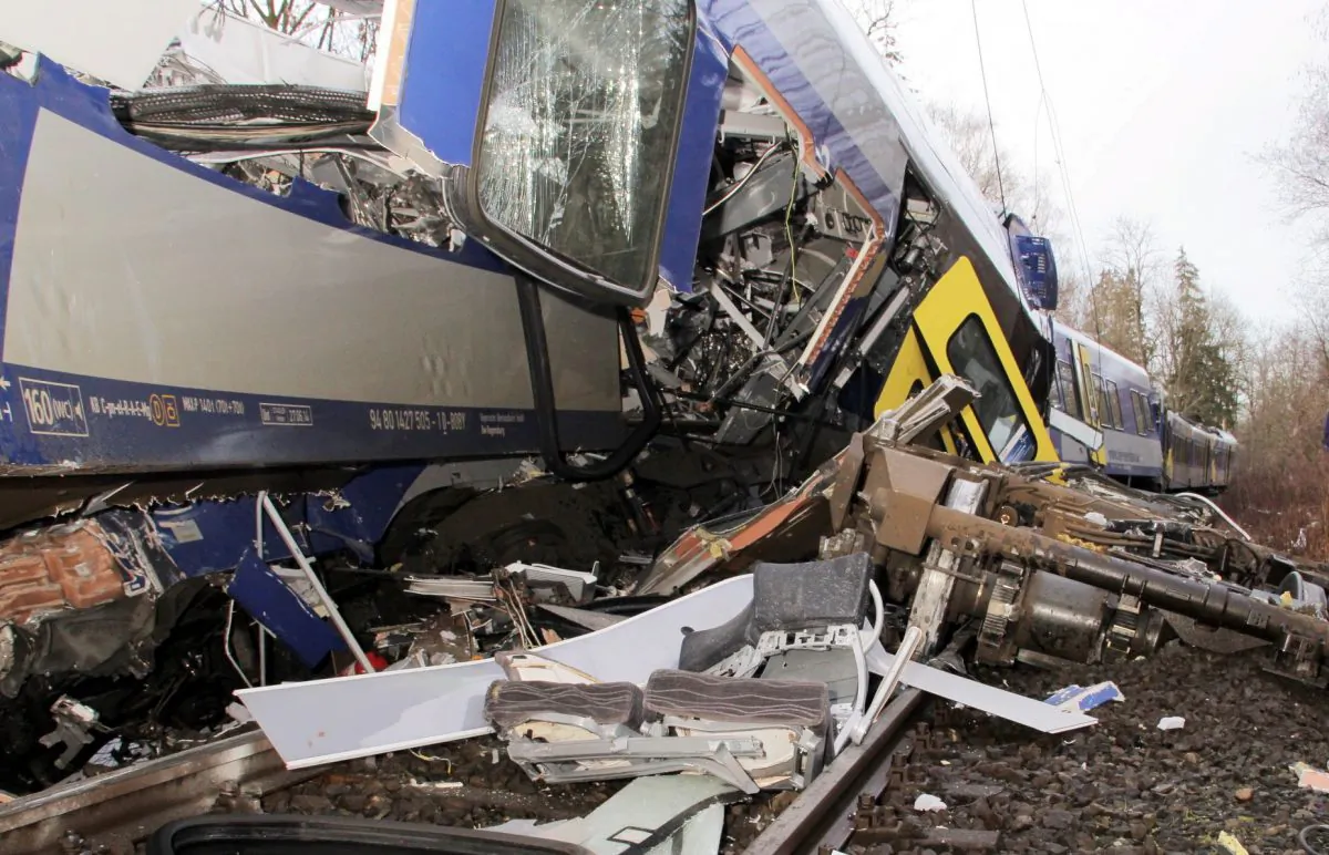 The axis sits separated from the carriage at the site of a train accident near Bad Aibling, Germany, Tuesday, Feb. 9, 2016. (Josef Reissner/dpa via AP)