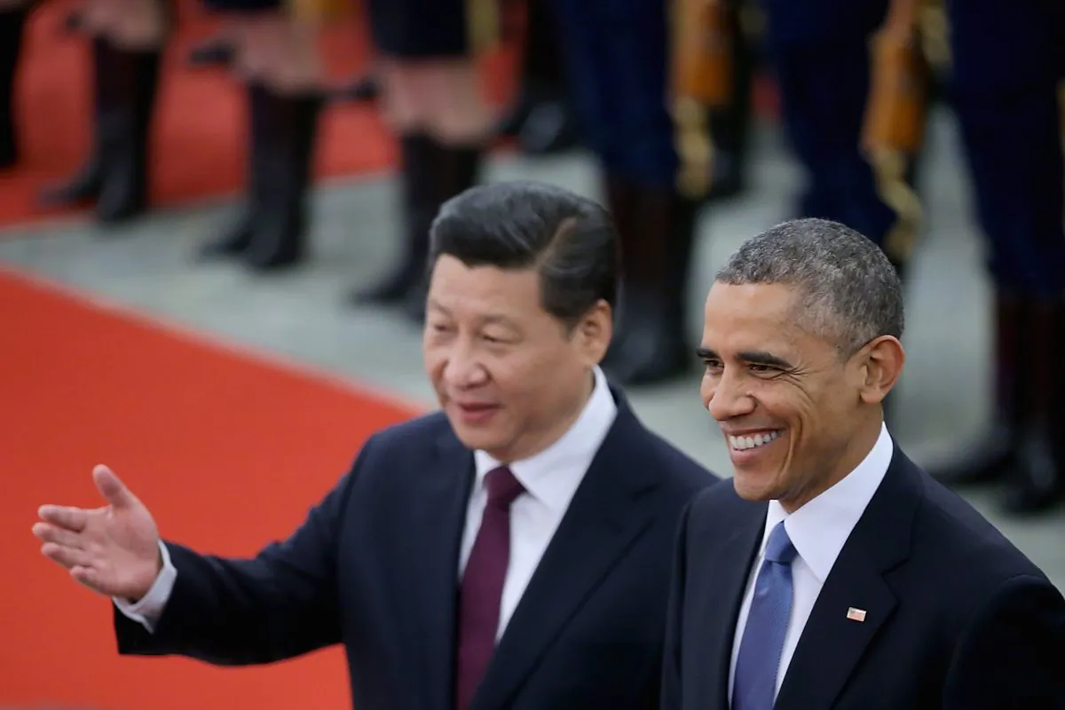 Chinese Communist Party leader Xi Jinping (L) accompanies President Barack Obama (R) to view an honor guard during a welcoming ceremony outside the Great Hall of the People on Nov. 12, 2014 in Beijing. Chinese media are having a field day criticizing the U.S. election primaries. (Feng Li/Getty Images)
