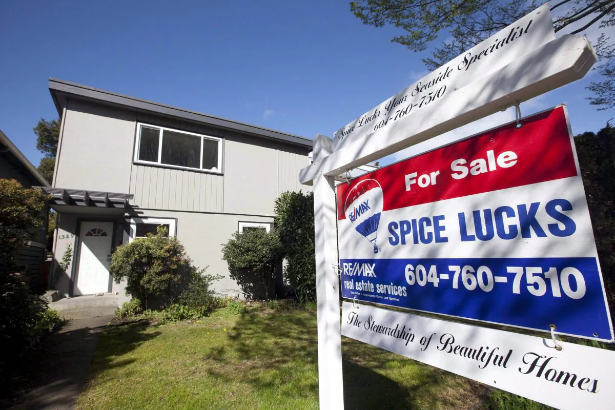 A two-storey home for sale in the Kitsilano area of Vancouver on April 4, 2010. Some Metro Vancouver real estate agents have allegedly been involved in “shadow flipping,” or selling a property multiple times before the closing date. (The Canadian Press/Jonathan Hayward)