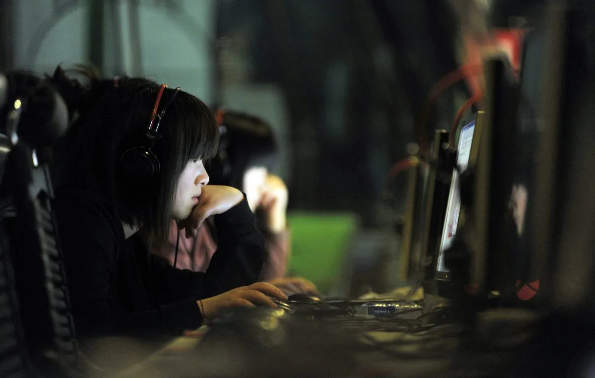 Chinese young women surf the net at an Internet bar in Beijing on May 11, 2011. Cyberspace Administration of China just provides a new explanation for censorship in China. (Gou Yige/AFP/Getty Images)