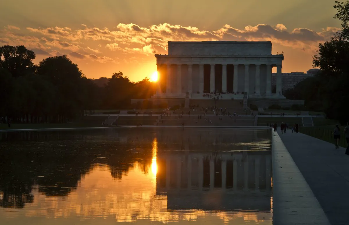 The sun sets behind the Lincoln Memorial in Washington on Sept. 30, 2013. (Mladen Antonov/AFP/Getty Images)
