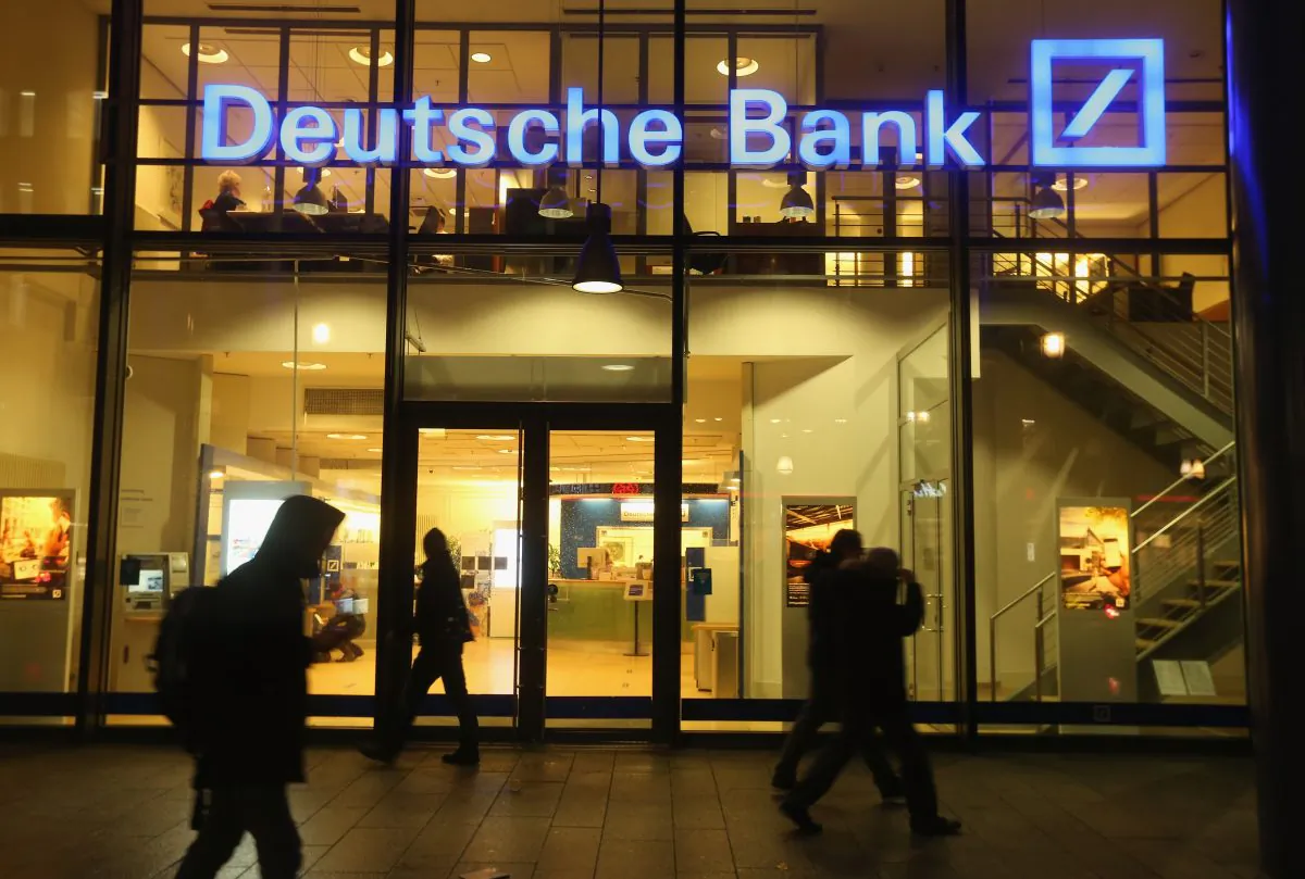People walk past a branch of Deutsche Bank in Berlin, Germany on Feb. 9, 2016. (Sean Gallup/Getty Images)