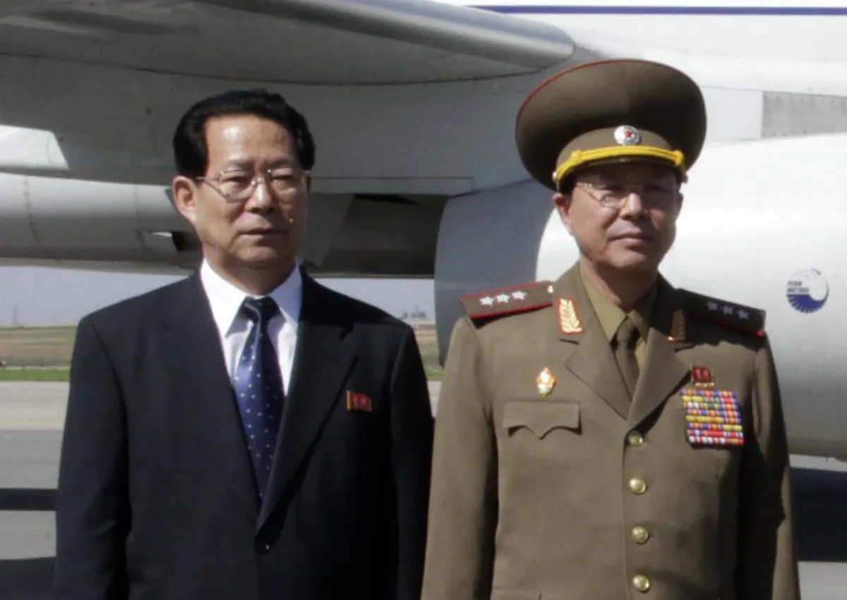 Kim Hyong Jun (L), deputy minister of Foreign Affairs, and Ri Yong Gil, col. gen. of the Korean People's Army, before leaving Pyongyang Airport in North Korea for China on May 22, 2013. (AP Photo/Kim Kwang Hyon)