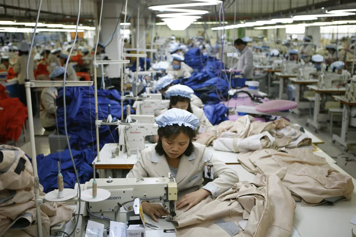 North Korean workers assemble jackets at a factory of a South Korean-owned company at the jointly-run Kaesong Industrial Complex, in Kaesong, North Korea, on Dec. 19, 2013. (Kim Hong-ji/AP)