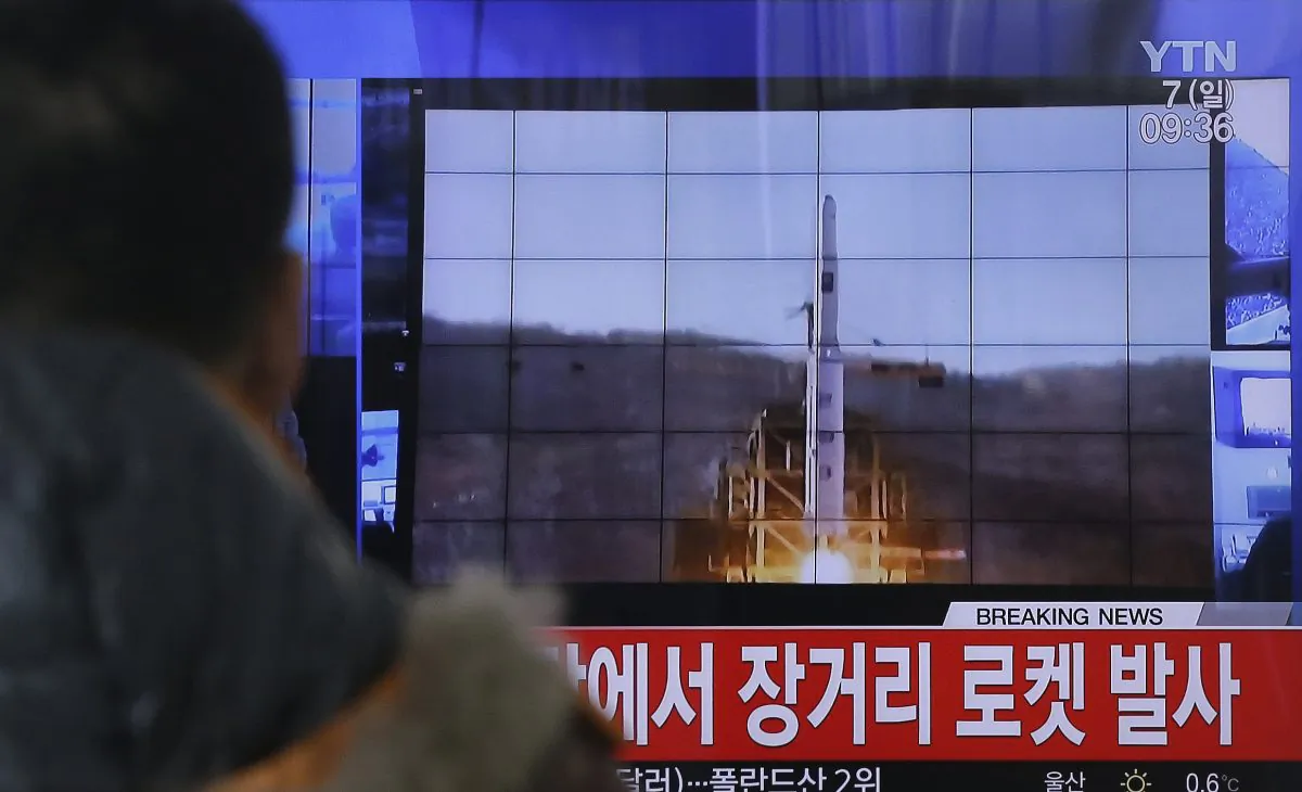 A South Korean man watches a TV news program with a file footage about North Korea's rocket launch at Seoul Railway Station in Seoul, South Korea, on Feb. 7, 2016. (Ahn Young-joon/AP)