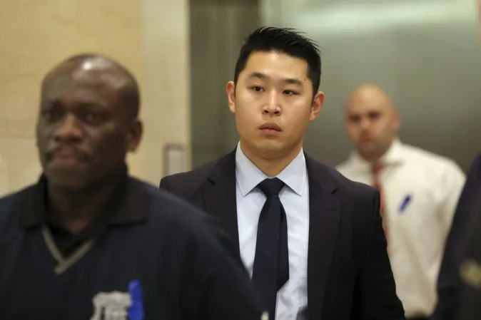 Police Officer Peter Liang exits the courtroom after his closing arguments in his trial on charges in the shooting death of Akai Gurley at the Brooklyn Supreme court on Feb. 9. (AP Photo/Mary Altaffer)