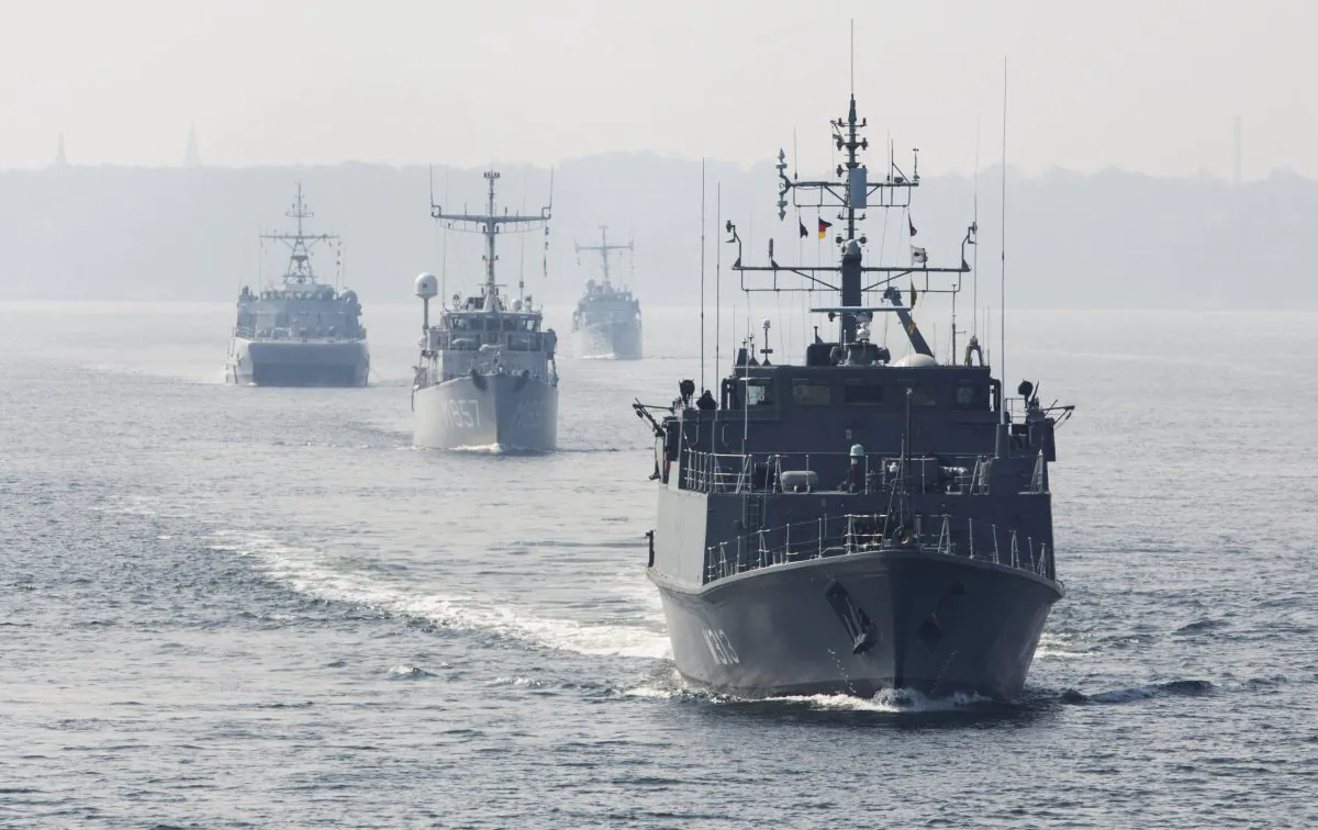 The warships of the standing NATO Mine Counter-Measures Group ONE with, from front to back, Estonian minehunter Admiral Cowen, Dutch minehunter Makkum, Norwegian minesweeper Otra, and Belgian minehunter Belis set sail from Kiel, Germany, on April 22, 2014. (AP Photo/Gero Breloer)
