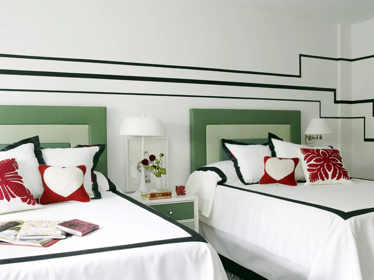 Upholstered headboards like the ones shown in this bedroom designed by Huh offer cheerful color and softness, while also absorbing sound. The quieter the bedroom, says designer Maxwell Ryan, the more welcoming and cozy the space will feel. (Ngoc Minh Ngo/Young Huh via AP)
 
