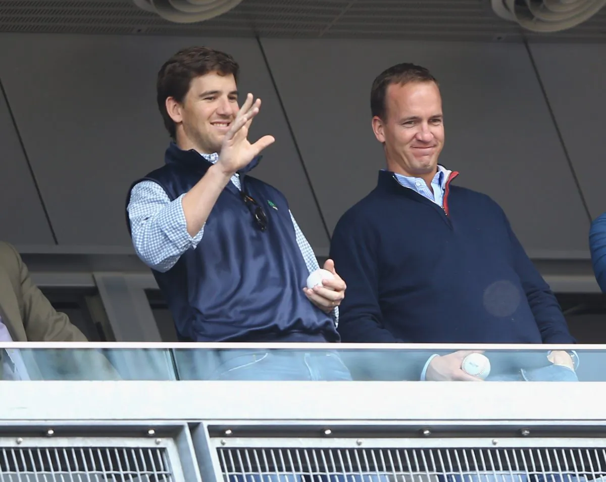 Eli Manning and his older brother Peyton Manning now have four Super Bowl rings between them. (Al Bello/Getty Images) 
