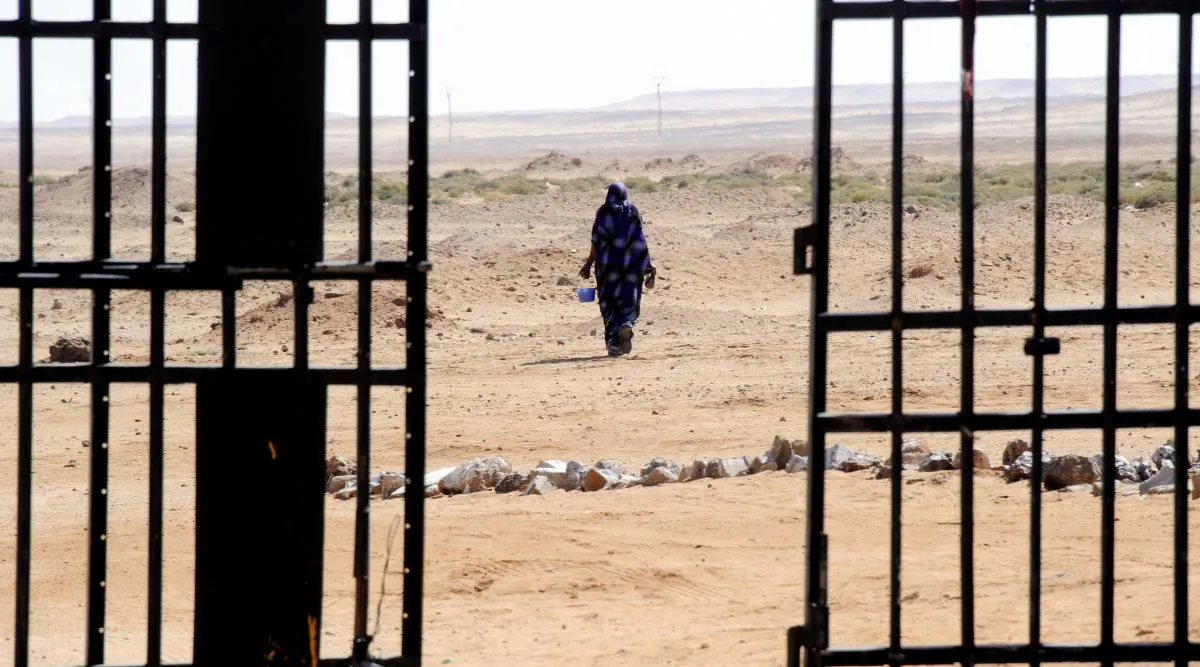 A Sahrawi woman walks in the desert near the Western Sahara refugees camp called "27 February" in Tindouf on March 1, 2011. Western Sahara is a former Spanish colony which was annexed in 1975 by Morocco. The Polisario Front, backed by Algeria, wants independence for the territory on the west African coast. (Dominique Faget/AFP/Getty Images)