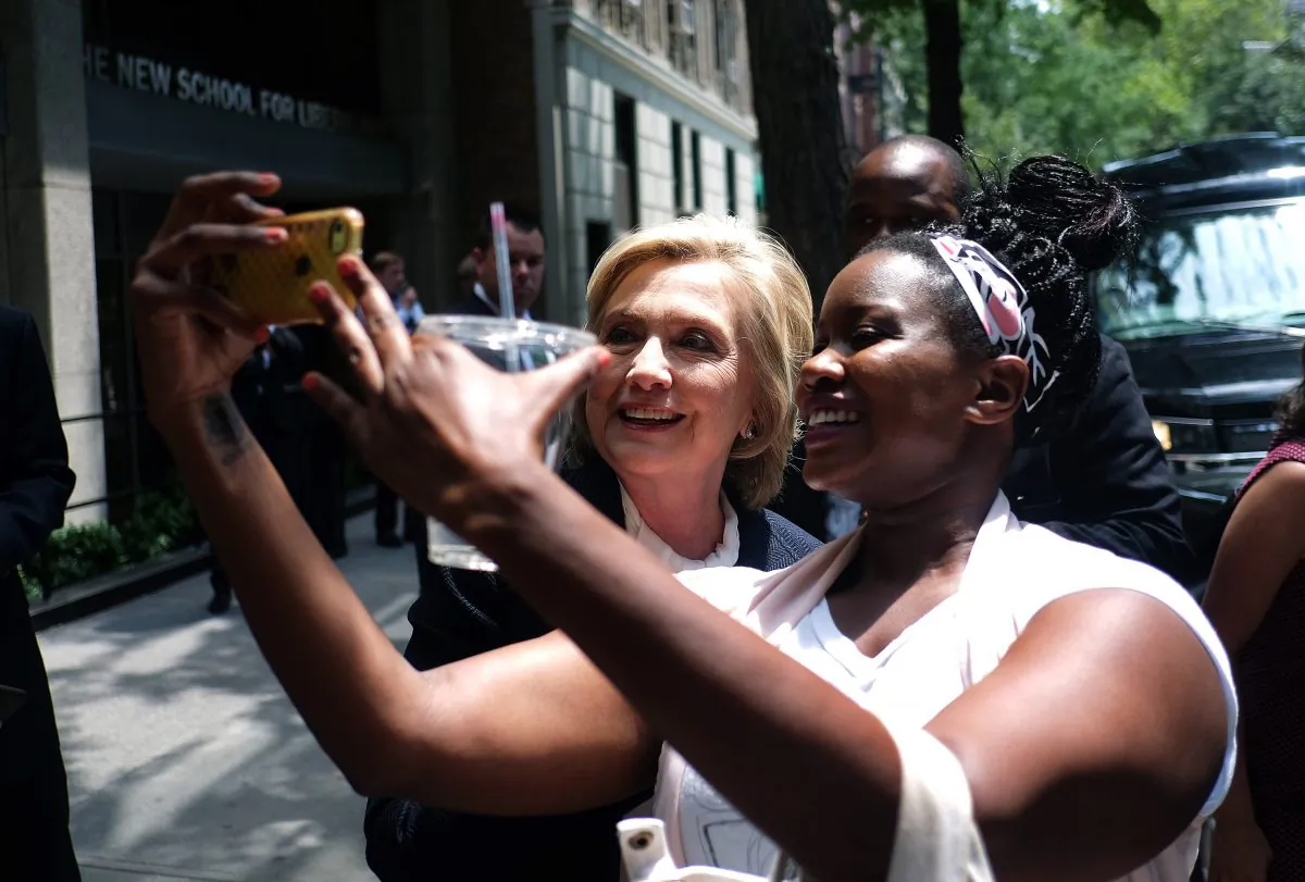 Democratic presidential hopeful Hillary Clinton takes a selfie with a student outside the New School in New York on July 13, 2015. (JEWEL SAMAD/AFP/Getty Images)