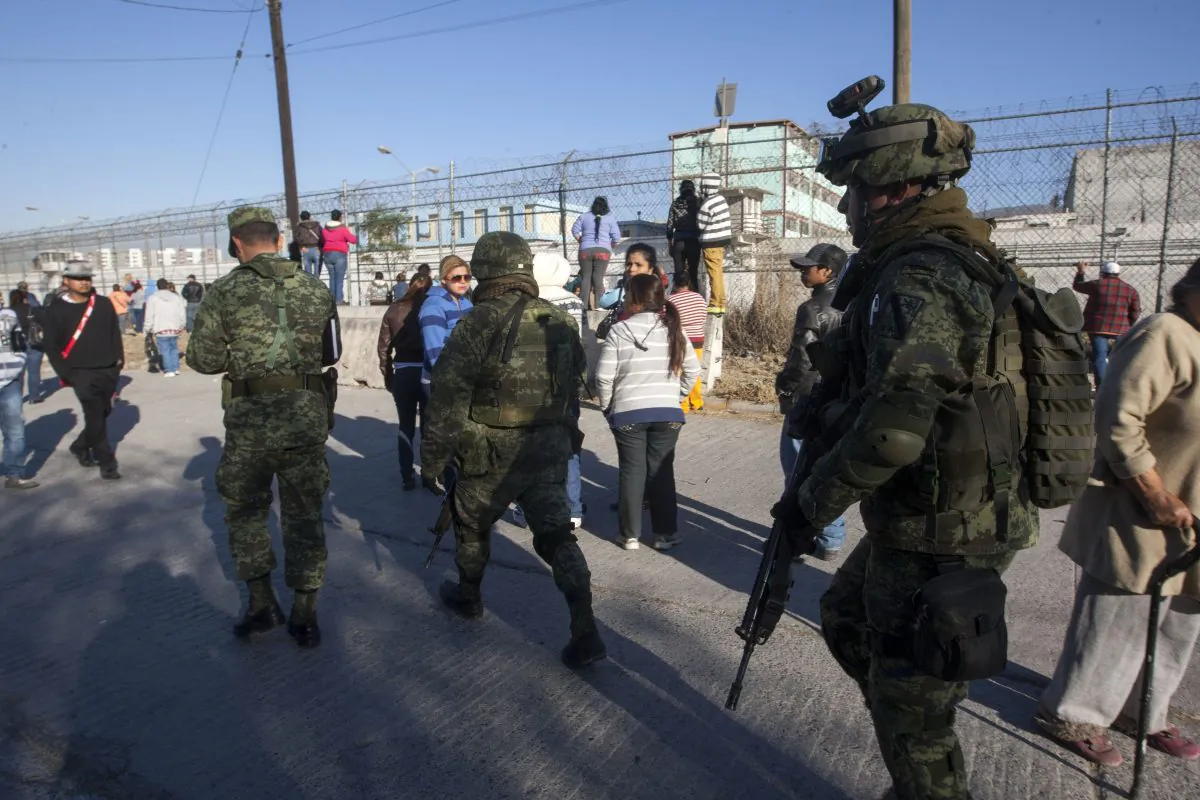 Soldiers walk outside the Topo Chico prison in the northern city of Monterrey in Mexico where according to Nuevo Leon State governor at least 52 people died and 12 were injured in a prison riot on February 11, 2016. (Julio Cesar Aguilar/AFP/Getty Images)