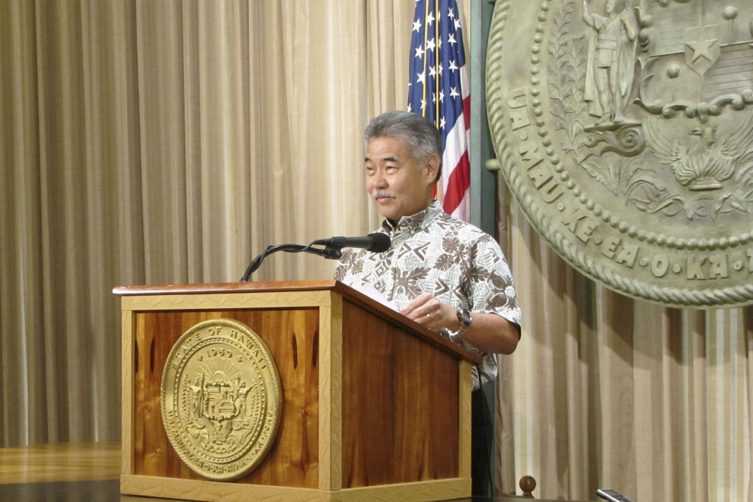 Hawaii Gov. David Ige talks with reporters at the capitol in Honolulu on Feb. 26, 2015. (AP Photo/Cathy Bussewitz)