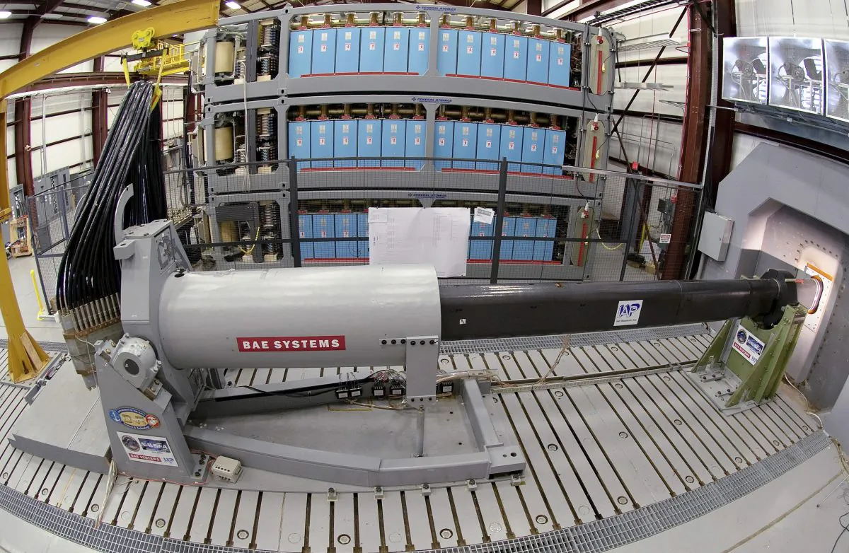 This photo provided by the U.S. Navy shows engineers at Naval Surface Warfare Center, Dahlgren Division, prepare to test the Office of Naval Research-funded electromagnetic railgun prototype launcher that was recently installed at a test facility in Dahlgren, Va. , on Feb. 23. 2012. (AP Photo/U.S. Navy, John F. Williams)