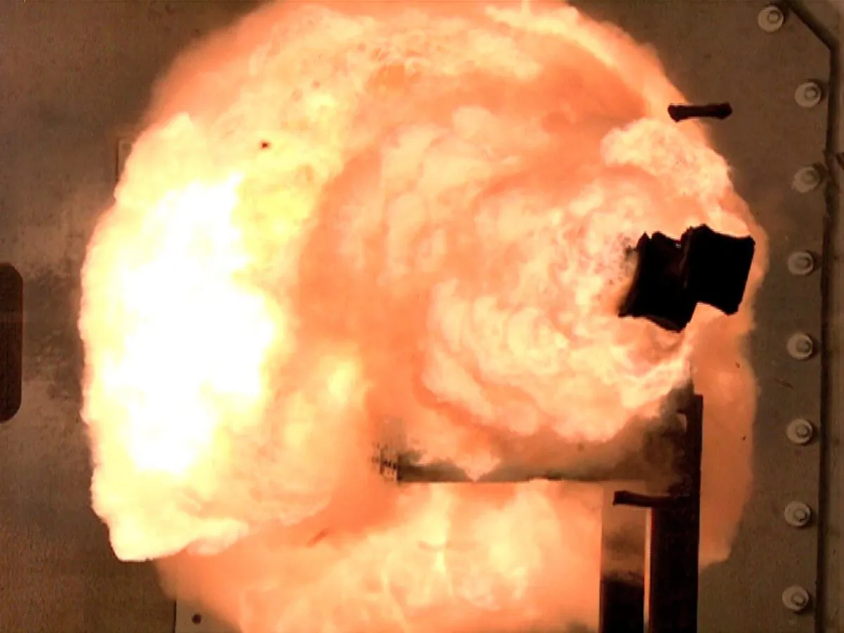 This Thursday Feb. 23. 2012 photo provided by the US Navy shows A high-speed camera captures the first full-energy shots electromagnetic railgun prototype launcher that was recently installed at a test facility in Dahlgren, Va. The test shots begin a month-long series of full-energy tests to evaluate the first of two industry-built launchers that will help bring the Navy a step closer to producing a next-generation, long-range weapon for surface ships. The new launcher brings advanced material and high-power technologies in a system that now resembles a large-caliber gun. (AP Photo/U.S. Navy, John F. Williams)