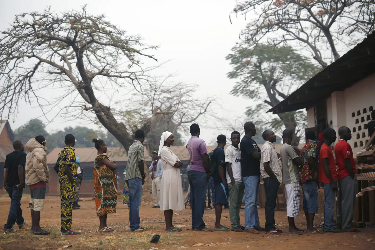 People line up to cast their ballots in the second round of presidential election and the first round of legislative elections in the Fatima district of Bangui, Central African Republic, on Feb. 14, 2016. (AP Photo/Jerome Delay)