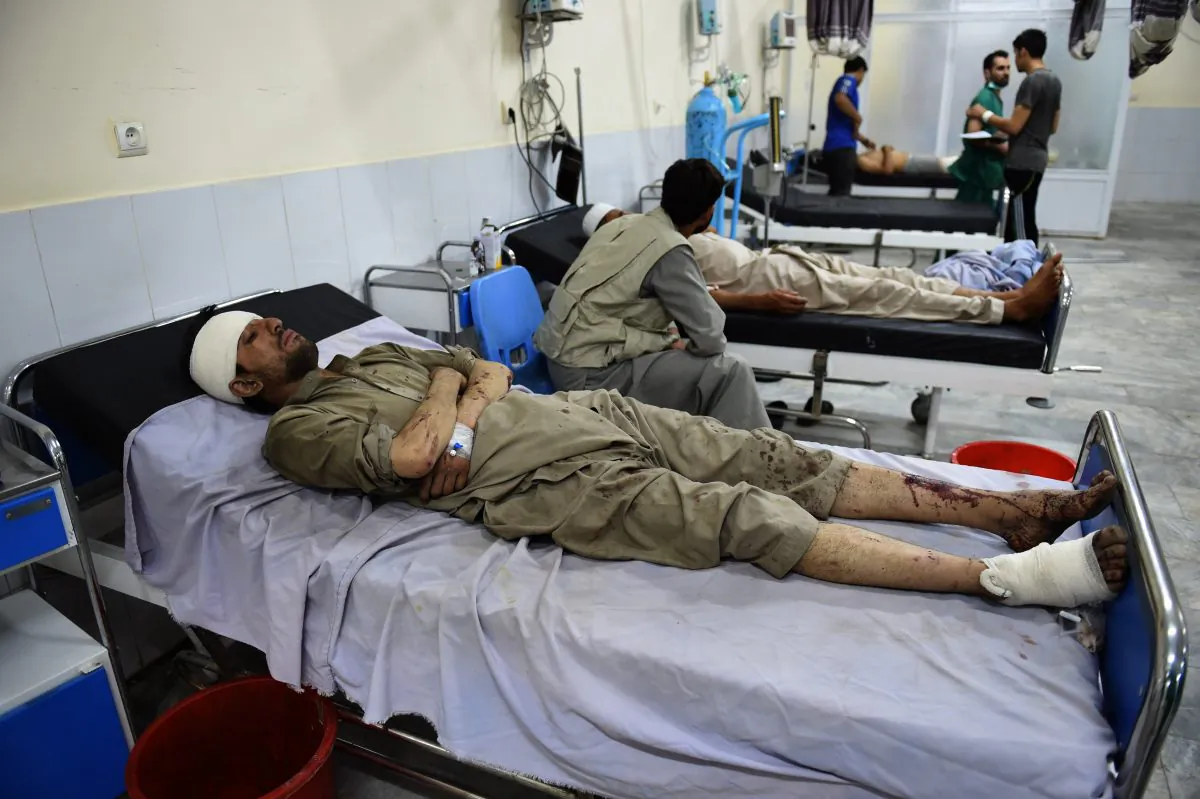 Injured Afghan men receives treatment at Wazir Akbar Khan hospital after a suicide truck bomb explosion in Kabul on August 7, 2015.  A powerful truck bomb killed at least seven people and wounded dozens of others, officials said, the first major attack in the Afghan capital since the announcement of Taliban leader Mullah Omar's death.     (Wakil Kohsar/AFP/Getty Images)
