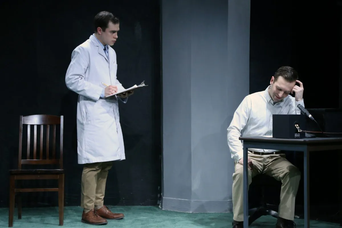 James Sanders (David Edward Jackson) is the experimenter who pressures volunteer subjects (here, Alex Herrald) to “inflict” pain on others in Frank Basloe’s play “Please Continue.” (Gerry Goodstein)