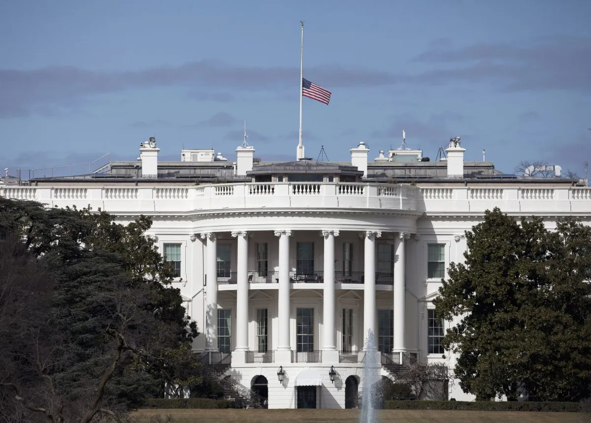 The flag flies at half-staff atop the White House in Washington, D.C., on Feb. 16, 2016. (AP Photo/Carolyn Kaster)