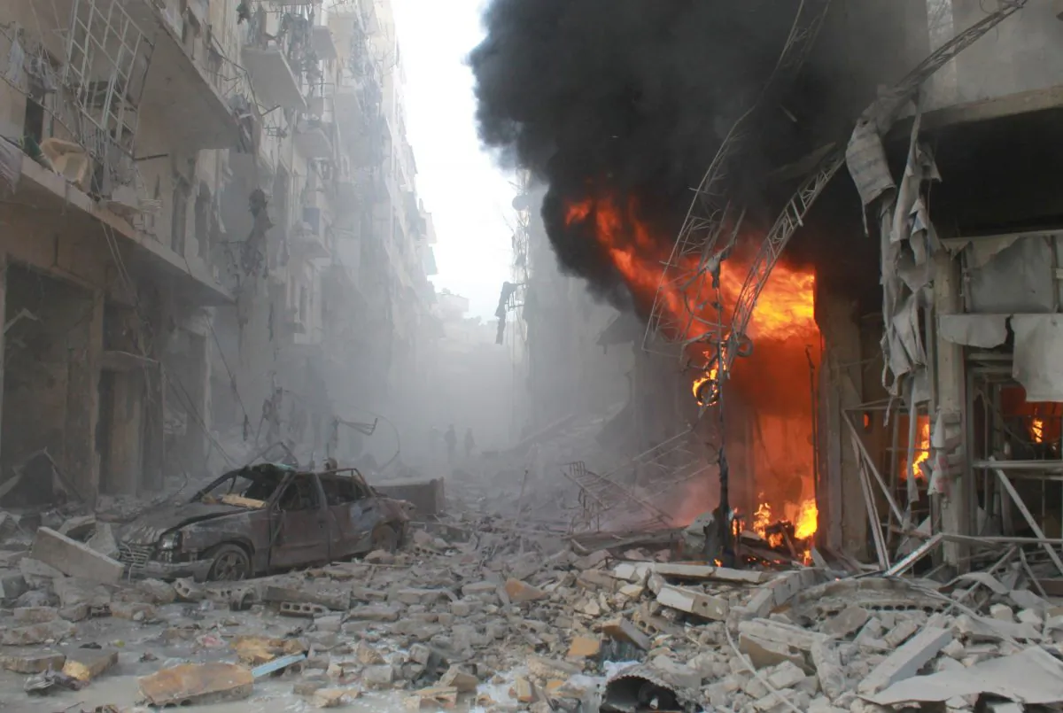 Debris cover a street and flames rise from a building following a reported airstrike by Syrian government forces on March 7, 2014, during the Friday prayer in the Sukkari neighborhood of the northern city of Aleppo. More than 250,000 people have been killed in Syria since the start of a March 2011 uprising against the Assad family's 40-year rule. (Baraa al-Halabi/AFP/Getty Images)