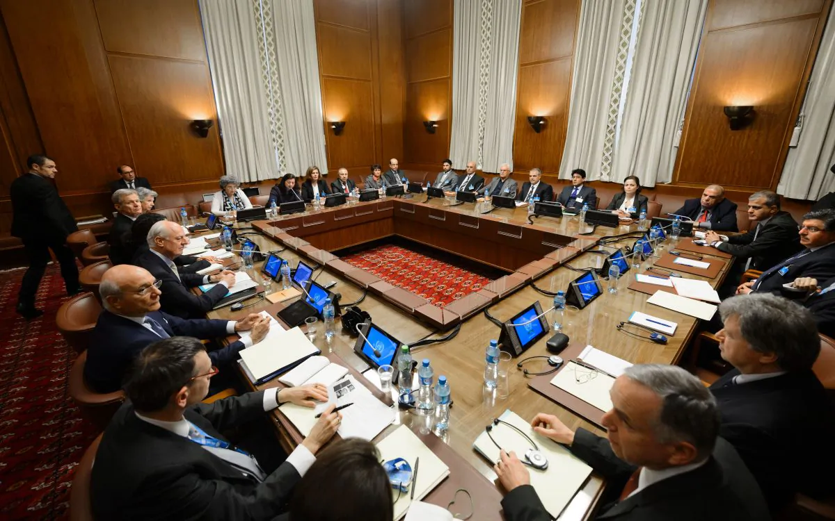 U.N. Special Envoy Staffan de Mistura (C-L) sits facing Syria's main opposition group during Syrian peace talks at the U.N. Offices in Geneva on Feb. 1, 2016. (Fabrice Coffrini/AFP/Getty Images)