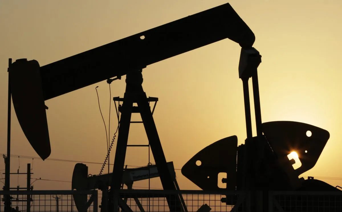 Oil pumps work in the desert oil fields of Sakhir, Bahrain, on Sept. 30, 2015. (AP Photo/Hasan Jamali)