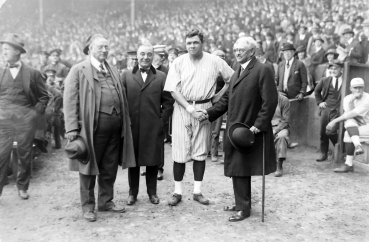 New York Yankees' owners, from left to right, Col. Tillinghast LHommedieu Huston and Jacob Ruppert appear with Babe Ruth and Gov. Nathan L. Miller of New York, Oct. 6, 1921.  (AP Photo)
