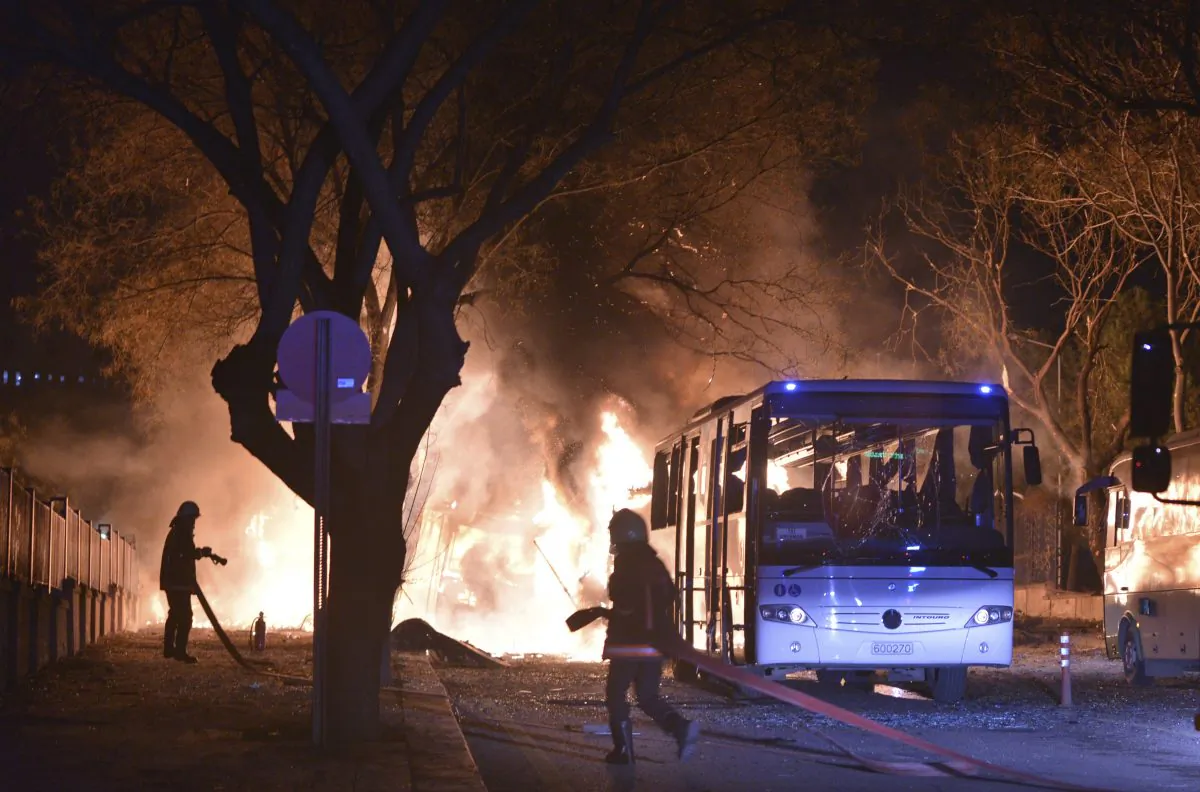 Firefighters work at a scene of fire from an explosion in Ankara, Turkey, on Feb. 17, 2016. (IHA via AP)