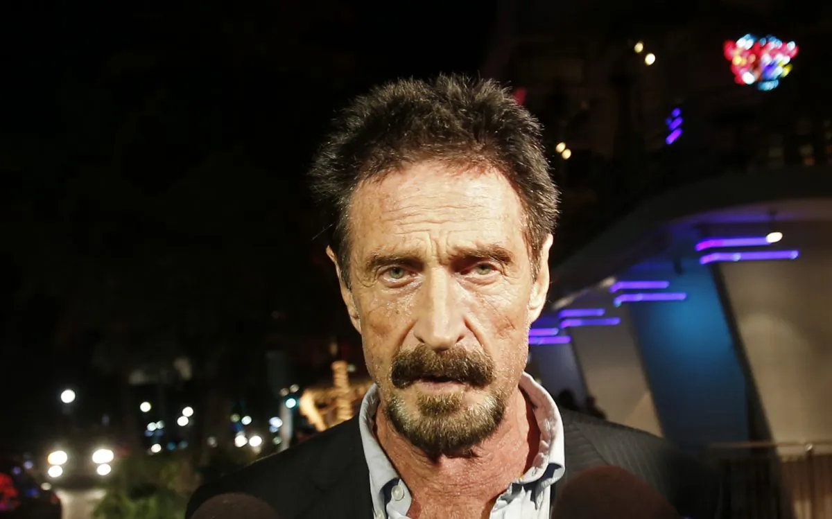 In this Wednesday, Dec 12, 2012 file photo, Anti-virus software founder John McAfee walks on Ocean Drive in the South Beach area of Miami Beach, Fla. (AP Photo/Alan Diaz, File)