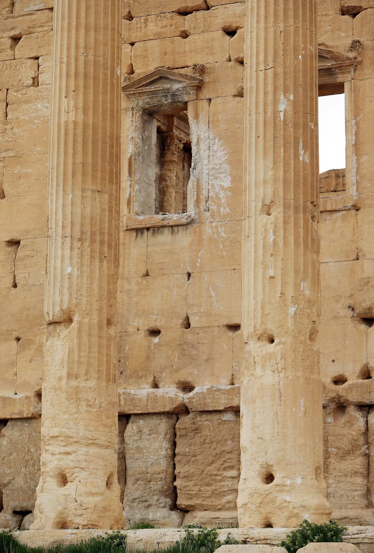 Damage during the Syria conflict caused by shelling on a wall in the ancient oasis city of Palmyra, 215 kilometres northeast of Damascus, Syria. (JOSEPH EID/AFP/Getty Images)