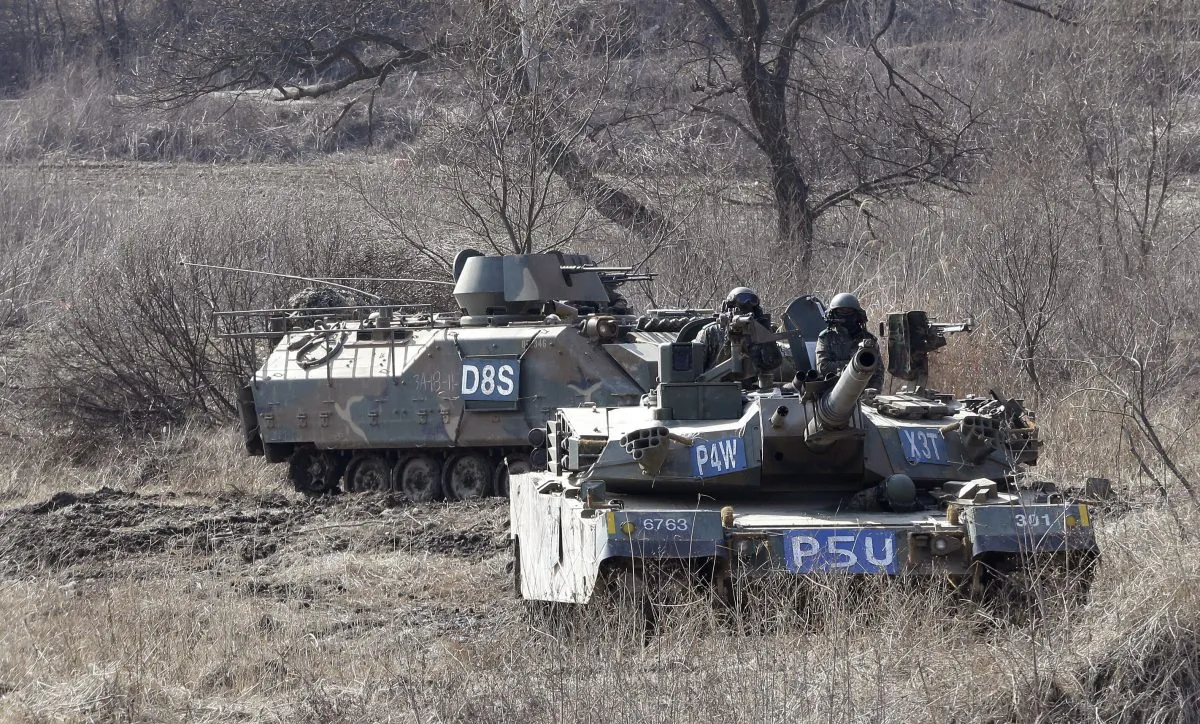 South Korean army's armored vehicles conduct an annual exercise in Paju, near the border with North Korea, on Feb. 20, 2016. (AP Photo/Ahn Young-joon)