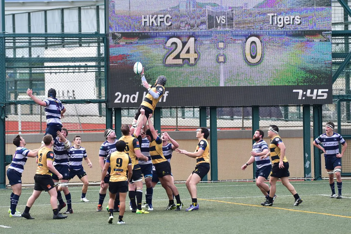 Borrelli Walsh USRC Tigers pressure the Natixis HKFC line to score 8 minutes into the second half in their Rugby Premiership match at Sports Road on Saturday Feb 13, 2016. (Bill Cox/Epoch Times)
