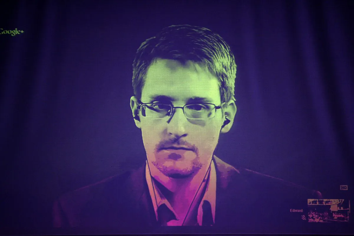 U.S. National Security Agency (NSA) whistleblower Edward Snowden speaks to European officials via videoconference during a parliamentary hearing on improving the protection of whistleblowers, at the Council of Europe in Strasbourg, eastern France, on June 24, 2014. (Frederick Florin/AFP/Getty Images)