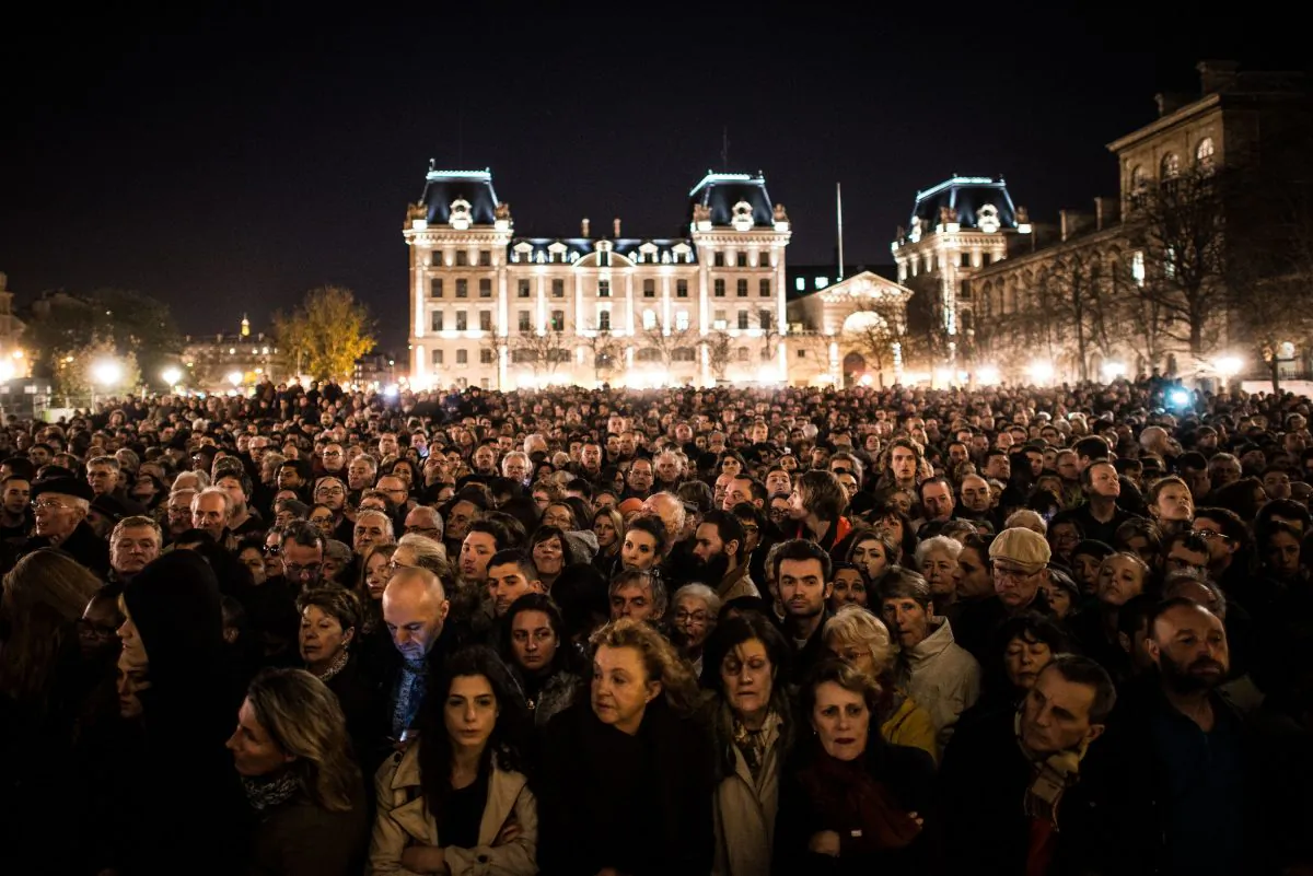 People gather outside of Notre Dame Cathedral in Paris, France, on Nov. 15, 2015, ahead of a ceremony to the victims of the Nov. 13 terrorist attacks. 129 people were killed and hundreds more injured in Paris following a series of terrorist acts in the French capital. (David Ramos/Getty Images)