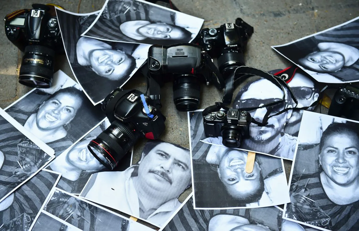 Photos of killed journalists and cameras outside the Veracruz state representation office during a journalists protest in Mexico City on Feb. 11, 2016. (Ronaldo Schemidt/AFP/Getty Images)