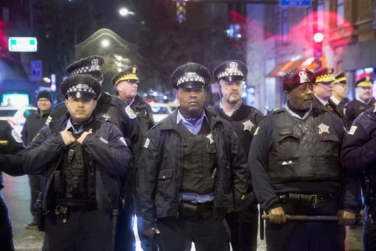 Police stand guard as demonstrators protest the death of Laquan McDonald on November 25, 2015 in Chicago, Illinois. (Scott Olson/Getty Images)