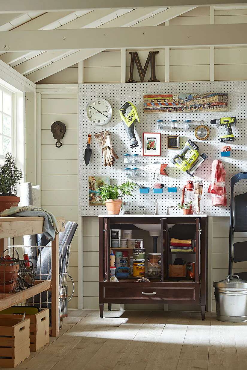 Bathroom vanities can be used in the garage as a stylish alternative to traditional garage organization. Plus, the sink helps keep garage grime at bay. (Home Depot via AP)