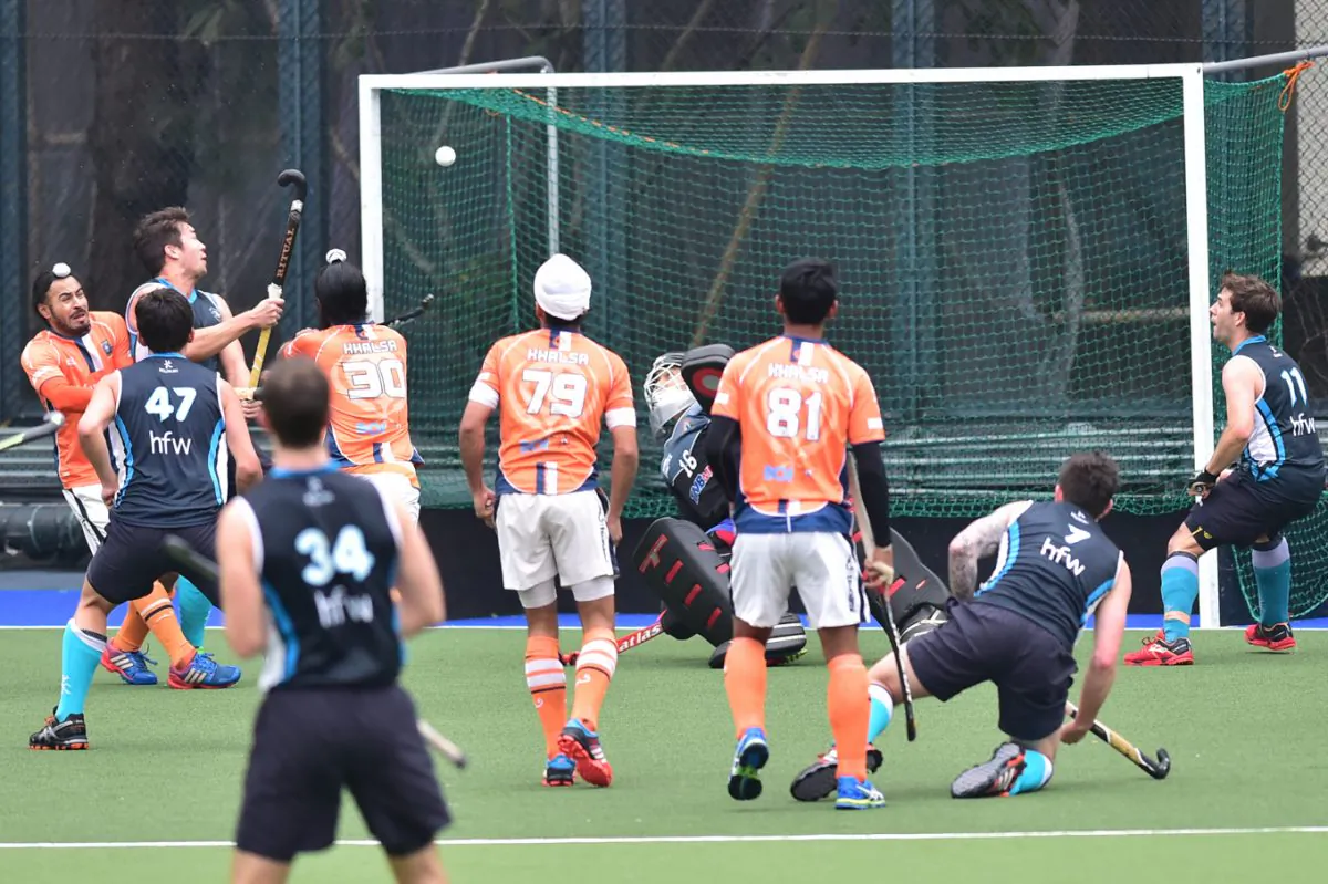 Jan Adams of HKFC-A pops in a high ball to score his second goal in their HKHA Premier Division match against Khalsa-A at King’s Park on Saturday Feb 21. (Bill Cox/Epoch Times)
