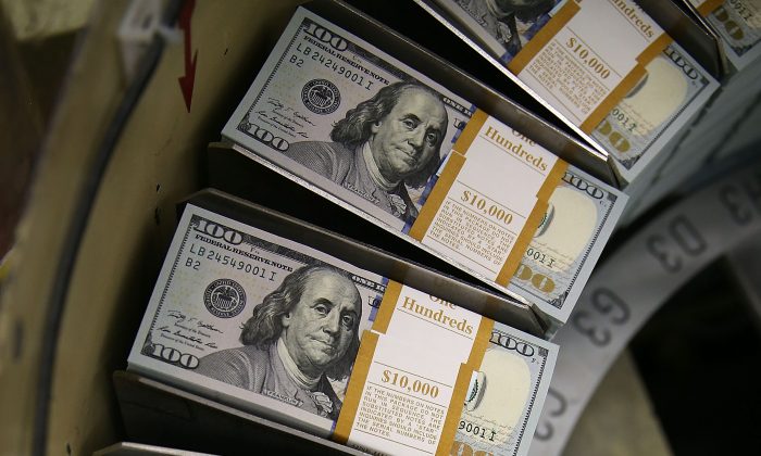 Newly redesigned $100 notes are printed at the Bureau of Engraving and Printing in Washington, D.C., on May 20, 2013. (Mark Wilson/Getty Images)