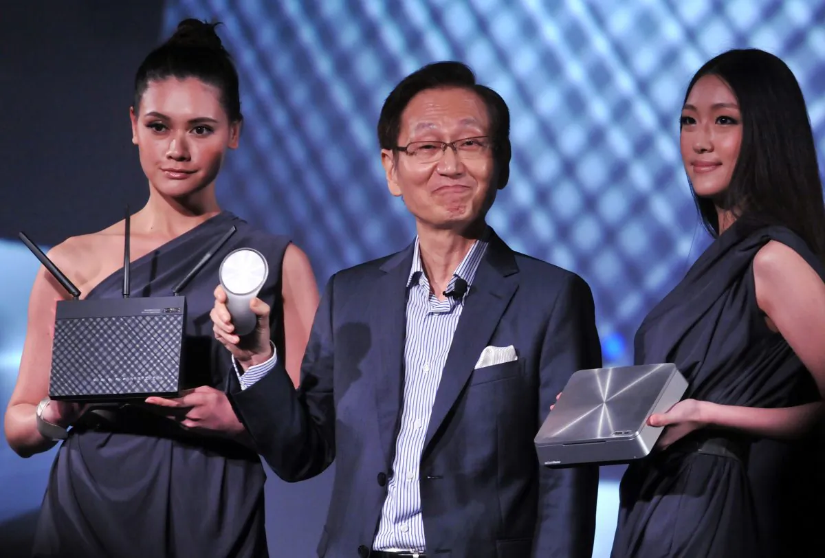 Jonney Shih (C), Chairman of Taiwan's ASUSTek Computer Inc., showcases a router during a press conference in Taipei, Taiwan, on June 3, 2013. ASUS is now required to put new security standards in place, after it was found its routers exposed user data. (Mandy Cheng/AFP/Getty Images)