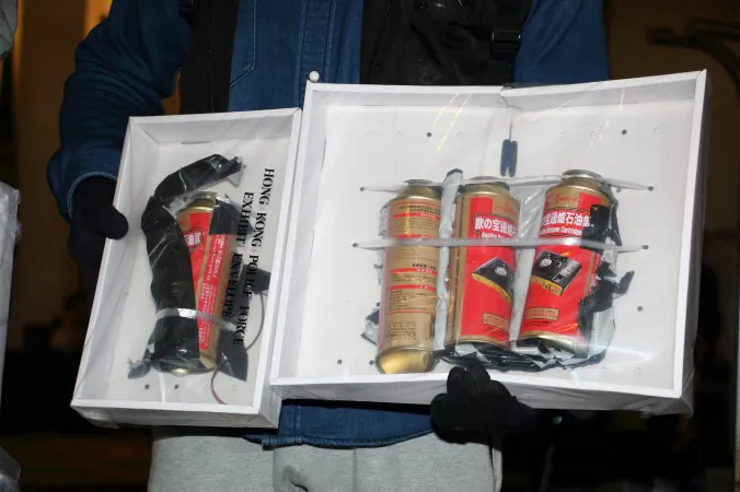 A Hong Kong police officer shows the fake bomb they found at the BP International Hotel in Hong Kong on Jan. 17, 2016. (Kiri Choi/Epoch Times)
